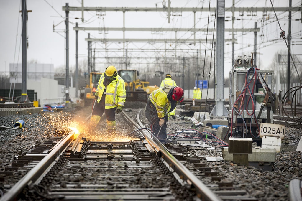 Railroad workers maintaining a track